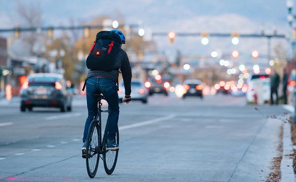 A person riding a street bicycle carrying the Original Shadow Guide 31.